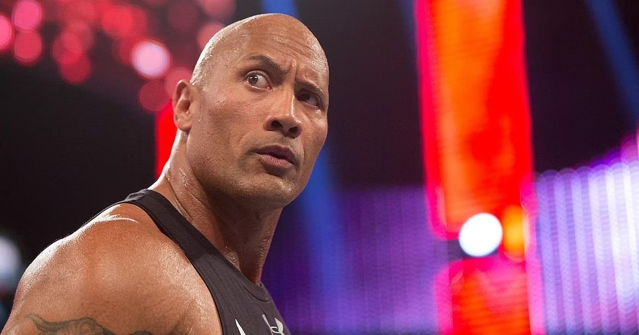 Dwayne "The Rock" Johnson with is iconic People's Eyebrow during a WWE production.
