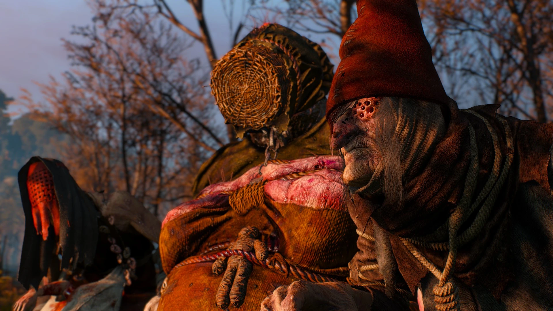 Three disturbing individuals stand in a swamp.